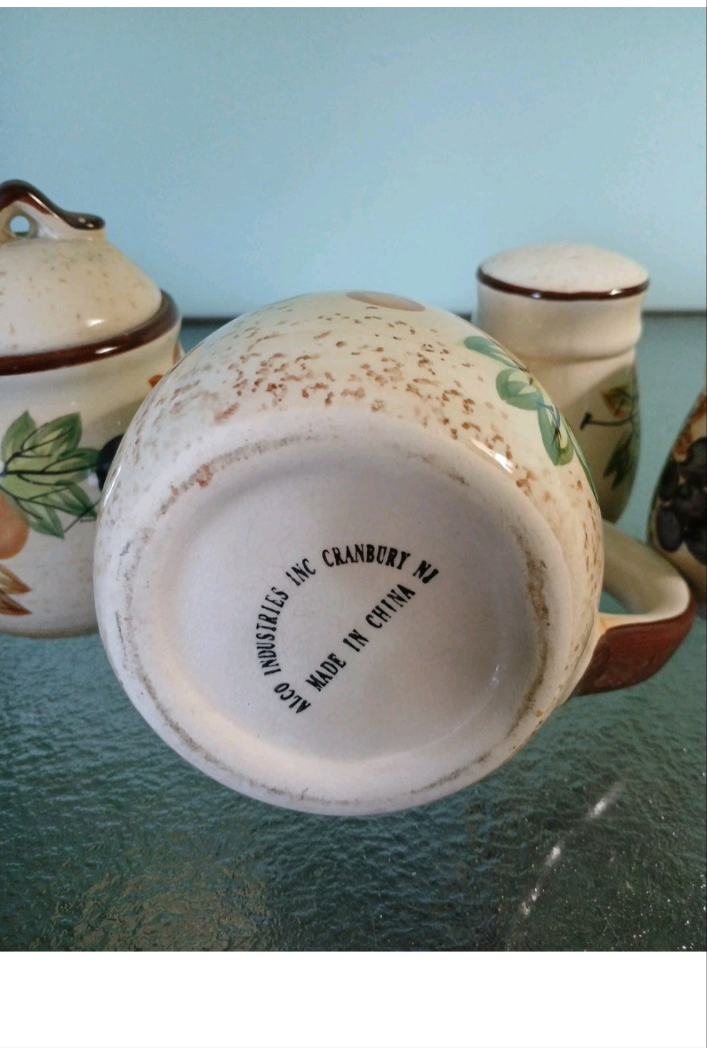 Ceramic mug with 'Made in China' text on a glass surface