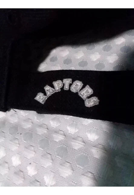 Close-up of a sports jersey with 'Raptors' branding on a black background