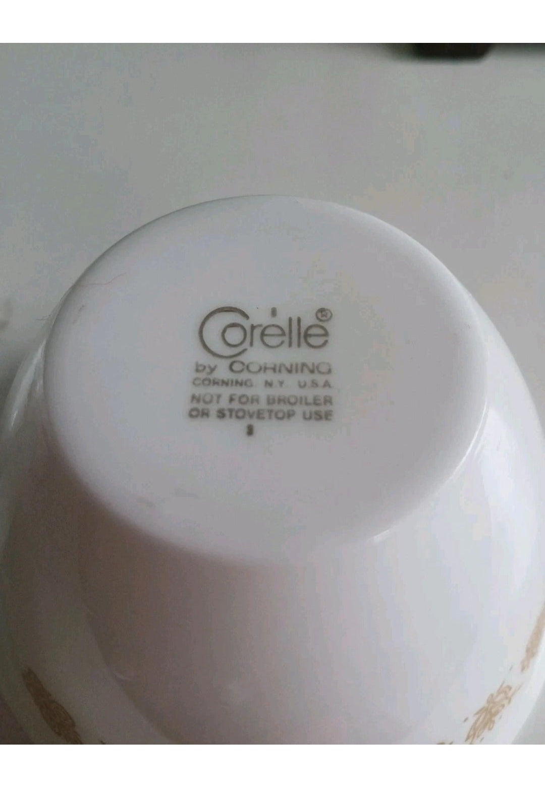 Corelle logo on a white bowl with a blurred background