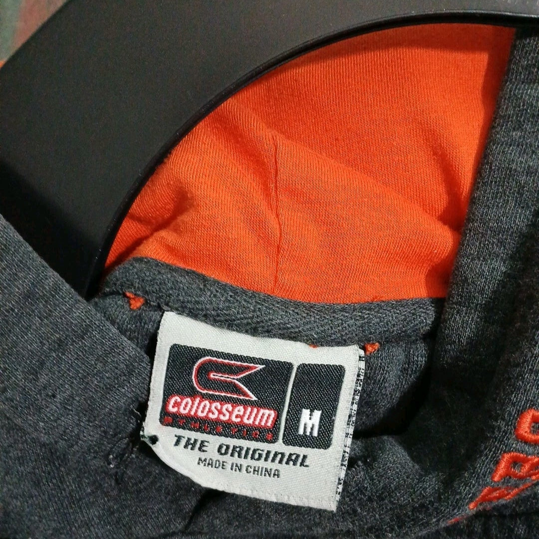 Close-up of a Colosseum label on a garment with orange lining.