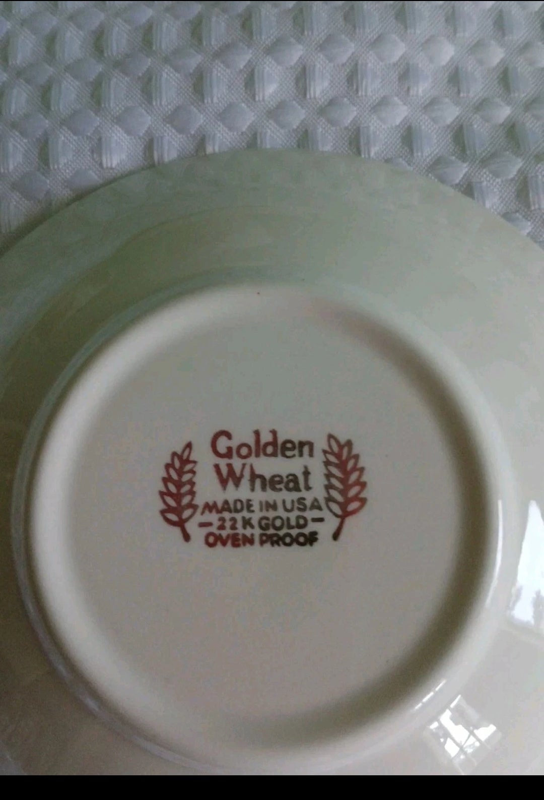 Plate with 'Golden Wheat' branding on a textured white background