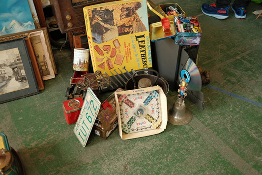 a pile of assorted items sitting on the floor