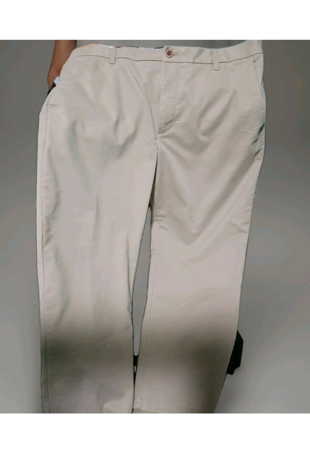 Beige pants on a plain background