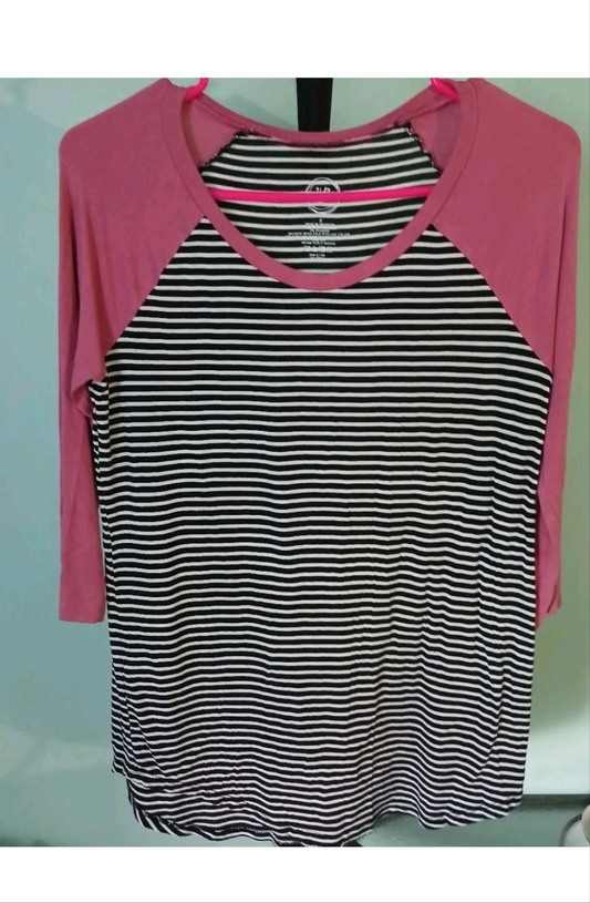 Black and white striped shirt with pink sleeves on a light blue background