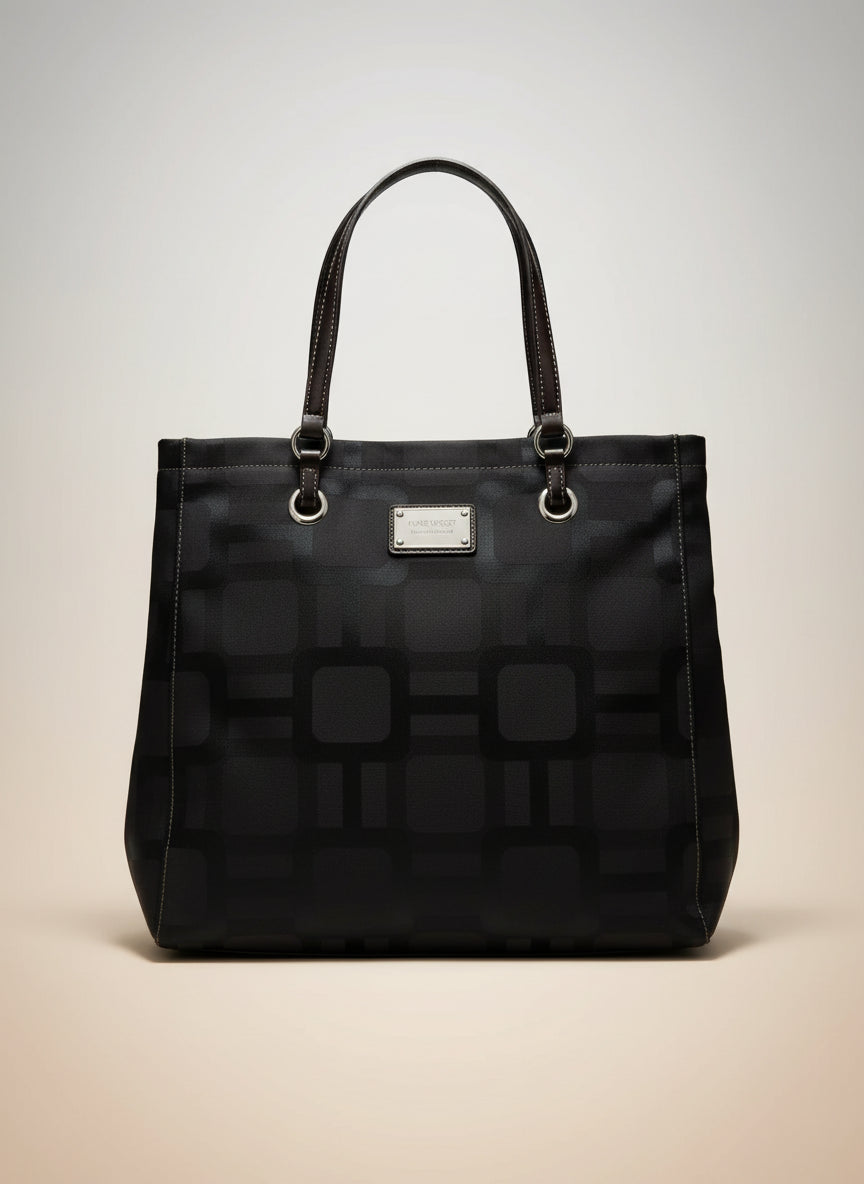 Black patterned handbag on a white background