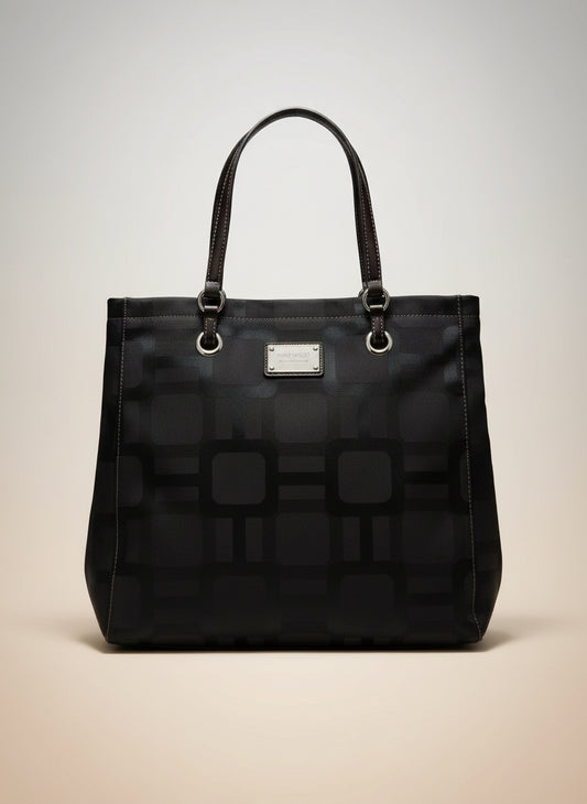 Black patterned handbag on a white background