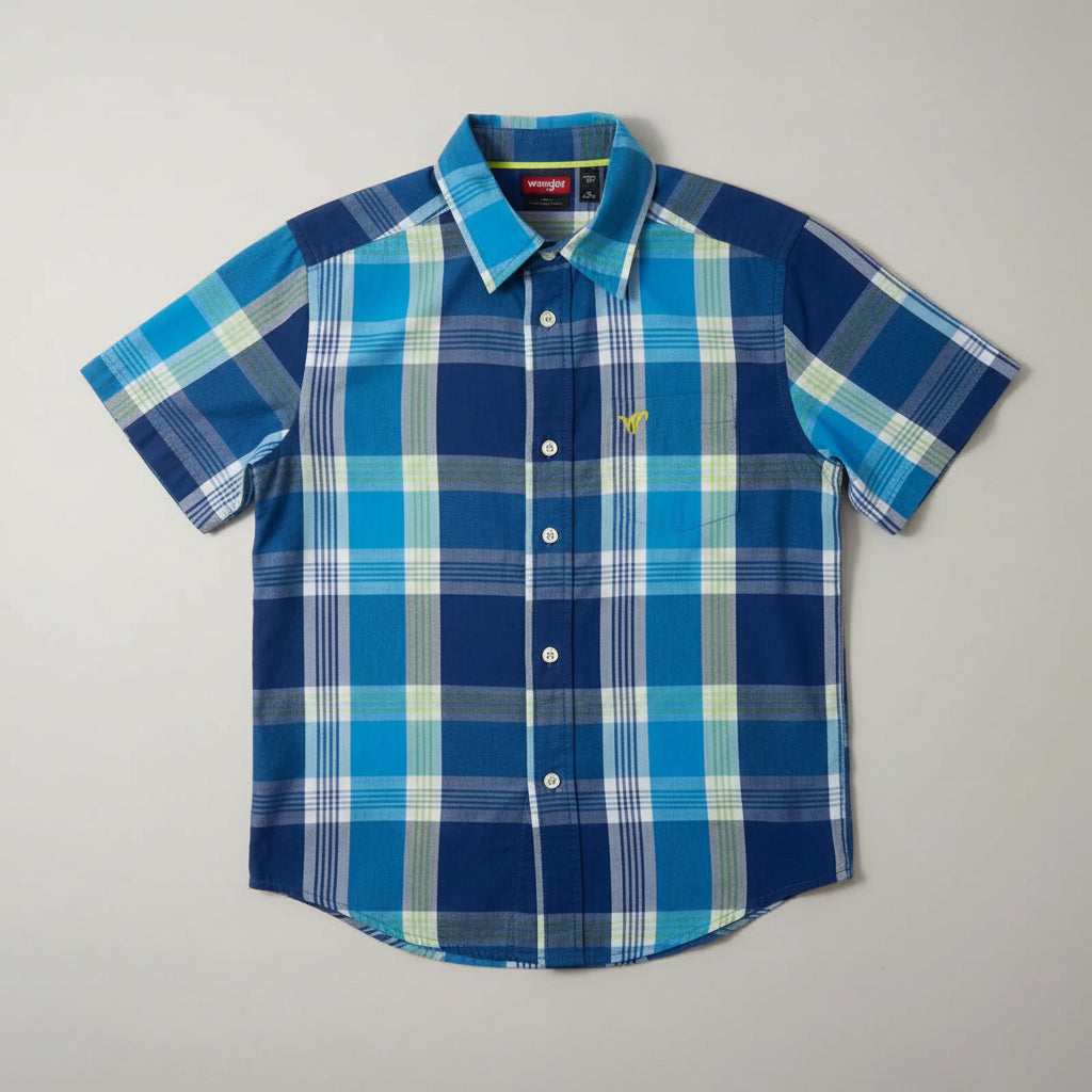 Blue and green plaid shirt on a hanger against a gray background