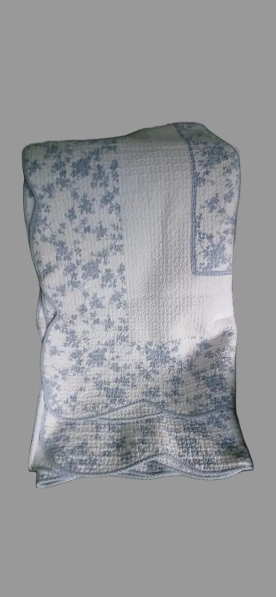 Floral-patterned fabric on a table with a neutral background